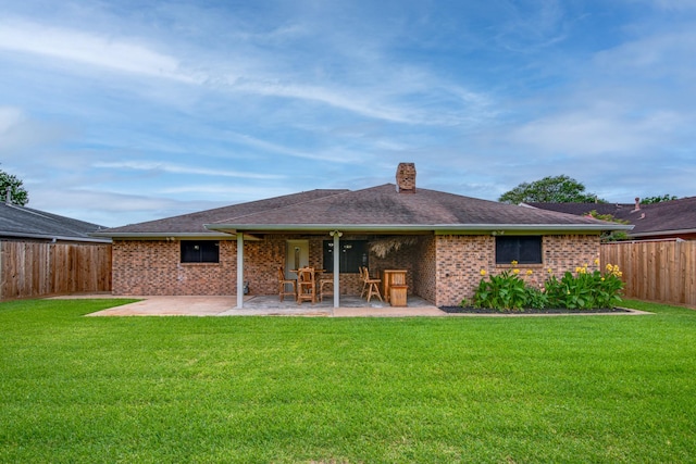 5214 Meadow Crest St, La Porte, TX 77571 - rear view of property featuring a patio, a chimney, brick siding, and a shingled roof
