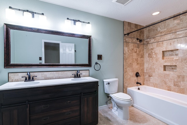 5214 Meadow Crest St, La Porte, TX 77571 - bathroom with toilet, double vanity, a textured ceiling, tub / shower combination, and tile patterned floors