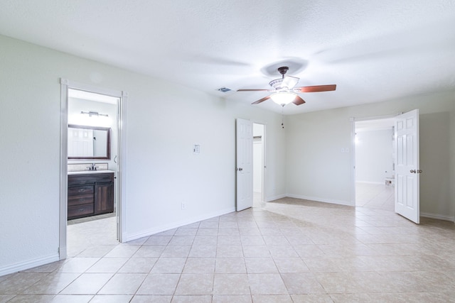 5214 Meadow Crest St, La Porte, TX 77571 - spare room featuring a ceiling fan, baseboards, and light tile patterned floors