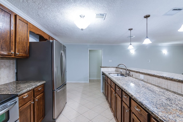 5214 Meadow Crest St, La Porte, TX 77571 - kitchen with a sink, decorative light fixtures, light tile patterned floors, crown molding, and stainless steel appliances