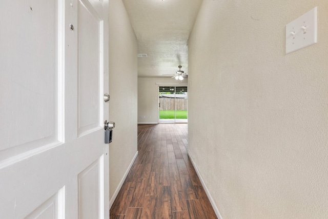 1121 E 13th St, Deer Park, TX 77536 - corridor featuring baseboards and dark wood-style floors
