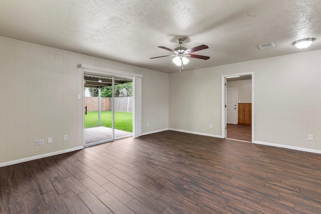 1121 E 13th St, Deer Park, TX 77536 - unfurnished room featuring a ceiling fan, a textured ceiling, dark wood finished floors, and baseboards