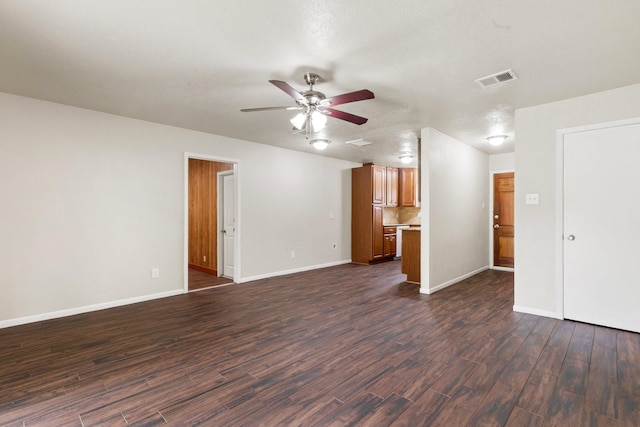 1121 E 13th St, Deer Park, TX 77536 - unfurnished living room featuring a ceiling fan, dark wood-style floors, and baseboards