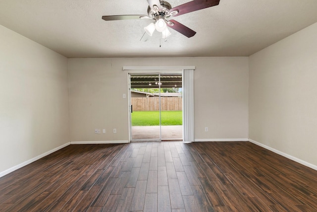 1121 E 13th St, Deer Park, TX 77536 - spare room with dark wood-style floors, a ceiling fan, baseboards, and a textured ceiling