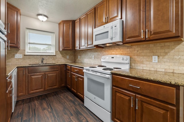 1121 E 13th St, Deer Park, TX 77536 - kitchen with white appliances, a sink, a textured ceiling, tasteful backsplash, and dark wood-style flooring