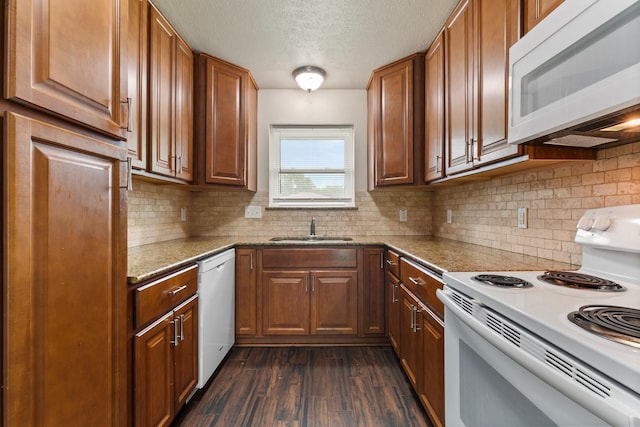 1121 E 13th St, Deer Park, TX 77536 - kitchen featuring white appliances, a sink, a textured ceiling, dark wood-type flooring, and decorative backsplash