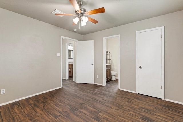 1121 E 13th St, Deer Park, TX 77536 - unfurnished bedroom featuring baseboards and dark wood finished floors