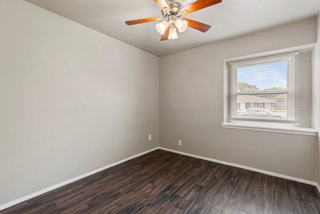 1121 E 13th St, Deer Park, TX 77536 - spare room with dark wood finished floors, baseboards, and ceiling fan
