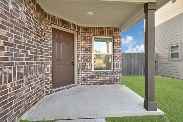 4354 Tulip Oak Dr, Houston, TX 77068 - doorway to property featuring brick siding and a patio