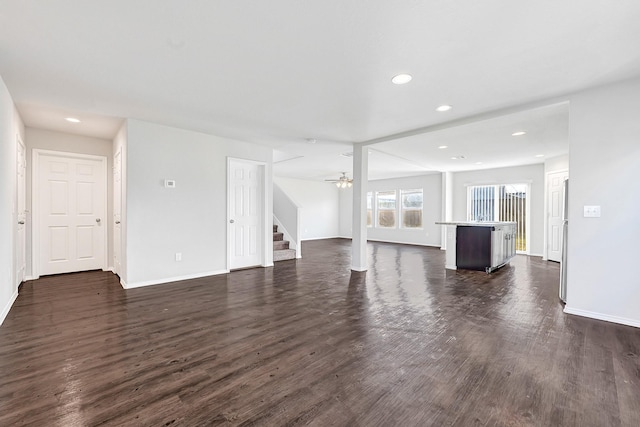 4354 Tulip Oak Dr, Houston, TX 77068 - unfurnished living room featuring stairs, dark wood-style floors, baseboards, recessed lighting, and ceiling fan