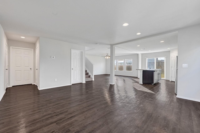 4354 Tulip Oak Dr, Houston, TX 77068 - unfurnished living room featuring stairway, dark wood-style floors, baseboards, recessed lighting, and ceiling fan