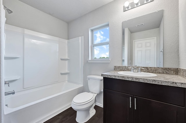 4354 Tulip Oak Dr, Houston, TX 77068 - bathroom with toilet, vanity, wood finished floors, tub / shower combination, and baseboards