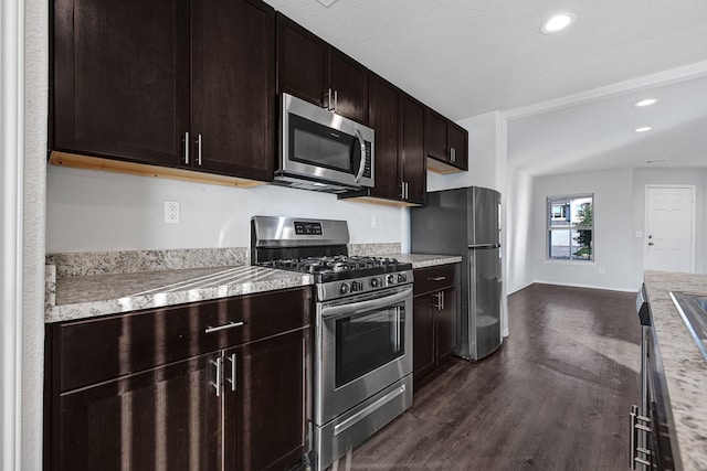 4354 Tulip Oak Dr, Houston, TX 77068 - kitchen featuring stainless steel appliances, light countertops, dark wood-style flooring, recessed lighting, and dark brown cabinetry