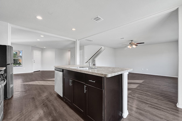 4354 Tulip Oak Dr, Houston, TX 77068 - kitchen with open floor plan, appliances with stainless steel finishes, a sink, dark wood-type flooring, and baseboards