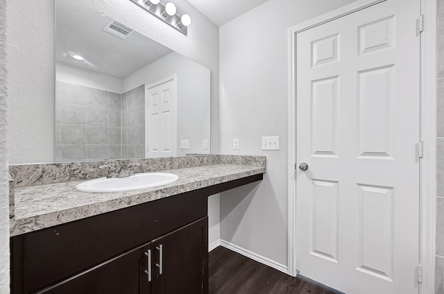 4354 Tulip Oak Dr, Houston, TX 77068 - bathroom featuring vanity, wood finished floors, and baseboards