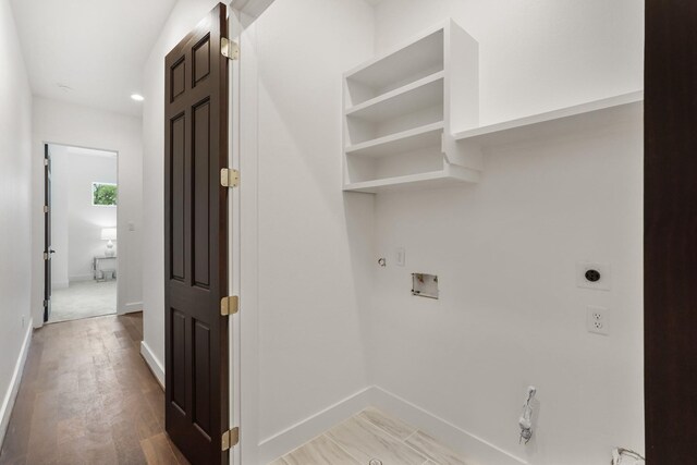 2022 Thonig Rd Unit C, Houston, TX 77055 - washroom featuring electric dryer hookup, hookup for a gas dryer, hookup for a washing machine, light wood-style flooring, and baseboards