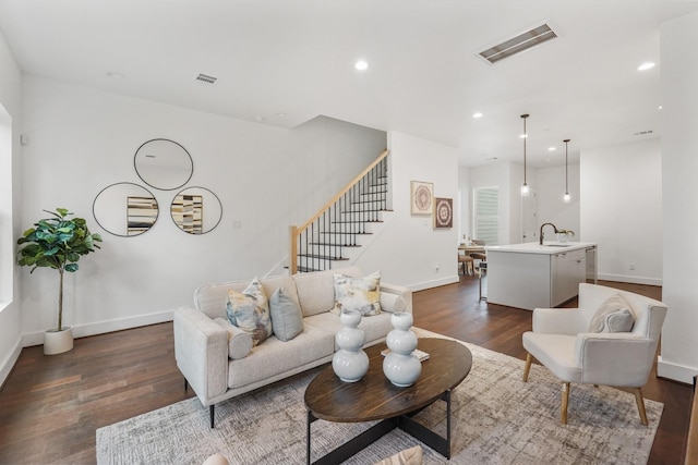 2022 Thonig Rd Unit C, Houston, TX 77055 - living room with baseboards, dark wood-style floors, stairs, and recessed lighting