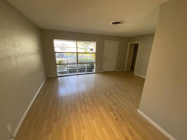 5810 Belmark St, Houston, TX 77033 - unfurnished room featuring wood finished floors and baseboards