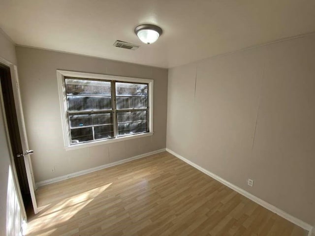5810 Belmark St, Houston, TX 77033 - unfurnished room with baseboards and wood finished floors