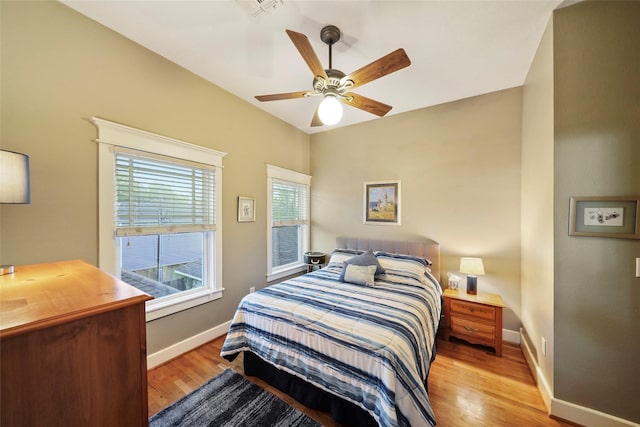 606 E 27th St, Houston, TX 77008 - bedroom with light wood-type flooring, baseboards, and a ceiling fan