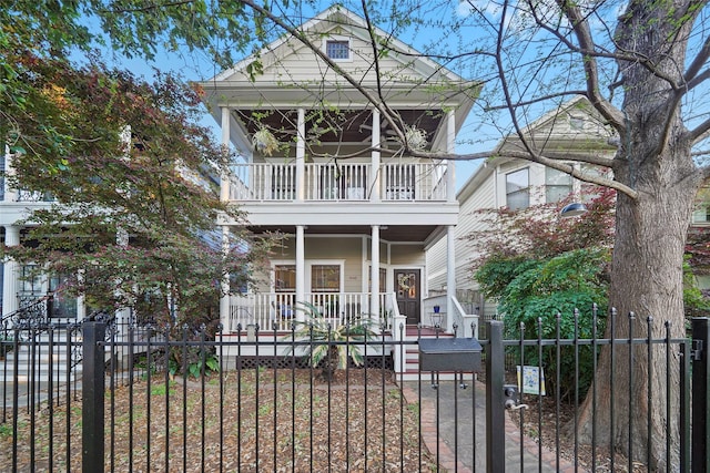 606 E 27th St, Houston, TX 77008 - view of front of home featuring covered porch, a balcony, a fenced front yard, and a gate