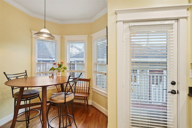 606 E 27th St, Houston, TX 77008 - dining space featuring wood finished floors, baseboards, and ornamental molding