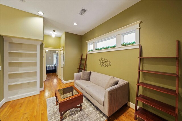 606 E 27th St, Houston, TX 77008 - living area featuring wood finished floors, baseboards, and recessed lighting