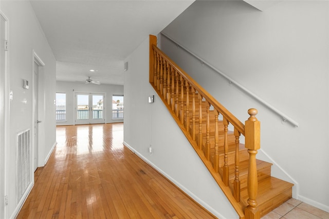 1022 Darcy St, Galveston, TX 77554 - stairs featuring ceiling fan, baseboards, hardwood / wood-style flooring, and recessed lighting