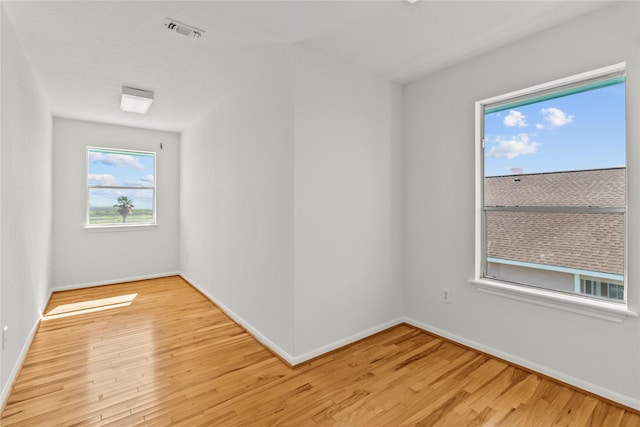 1022 Darcy St, Galveston, TX 77554 - spare room featuring light wood-style floors and baseboards