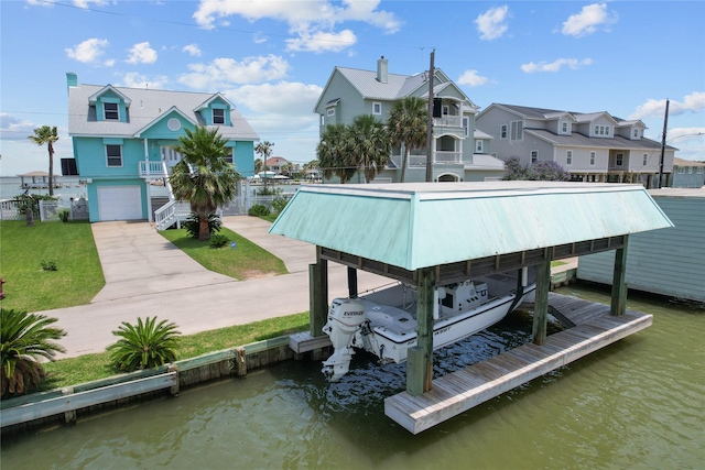 1022 Darcy St, Galveston, TX 77554 - dock area featuring boat lift, a residential view, and a water view