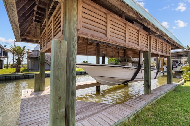 1022 Darcy St, Galveston, TX 77554 - dock featuring boat lift and a water view