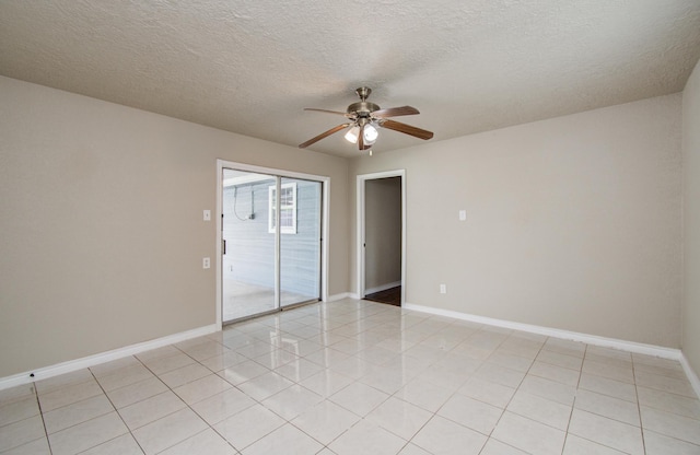 2020 Vince St, Pasadena, TX 77502 - empty room with a ceiling fan, baseboards, a textured ceiling, and light tile patterned flooring