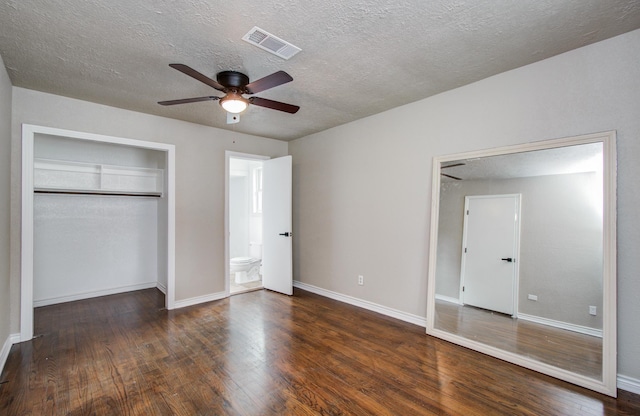 2020 Vince St, Pasadena, TX 77502 - unfurnished bedroom with wood finished floors, a textured ceiling, and baseboards