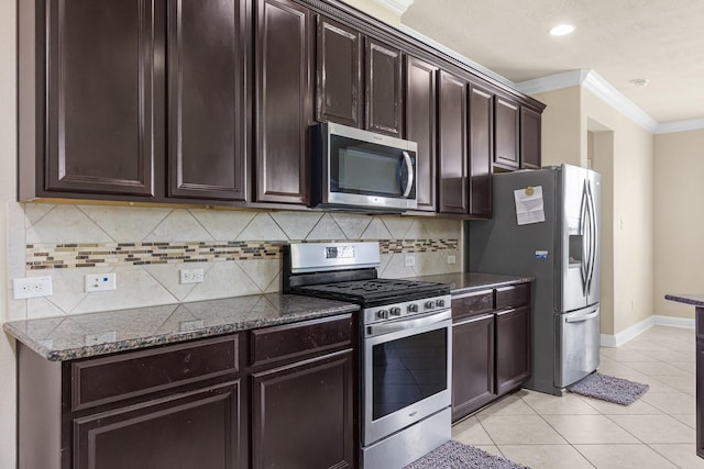 26010 Pagemill Ln, Richmond, TX 77406 - kitchen featuring appliances with stainless steel finishes, ornamental molding, light tile patterned floors, baseboards, and decorative backsplash
