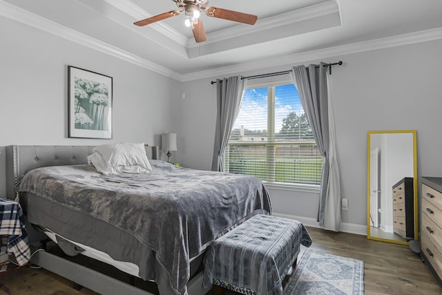 26010 Pagemill Ln, Richmond, TX 77406 - bedroom featuring a raised ceiling, ornamental molding, wood finished floors, baseboards, and ceiling fan