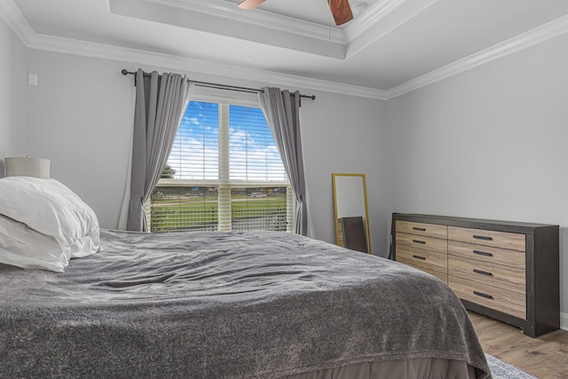26010 Pagemill Ln, Richmond, TX 77406 - bedroom with a raised ceiling, ornamental molding, wood finished floors, and ceiling fan