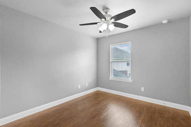26010 Pagemill Ln, Richmond, TX 77406 - unfurnished room featuring dark wood finished floors, baseboards, ceiling fan, and a smoke detector