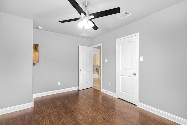 26010 Pagemill Ln, Richmond, TX 77406 - unfurnished bedroom featuring baseboards, wood finished floors, and ceiling fan