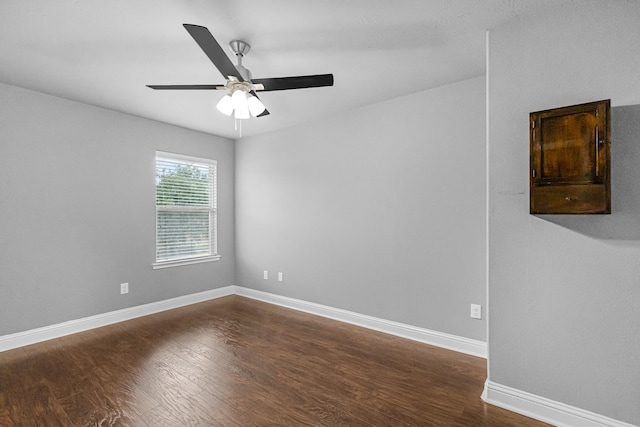 26010 Pagemill Ln, Richmond, TX 77406 - spare room featuring dark wood-type flooring, baseboards, and ceiling fan