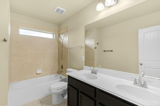 26010 Pagemill Ln, Richmond, TX 77406 - full bathroom featuring toilet, double vanity, washtub / shower combination, and tile patterned floors