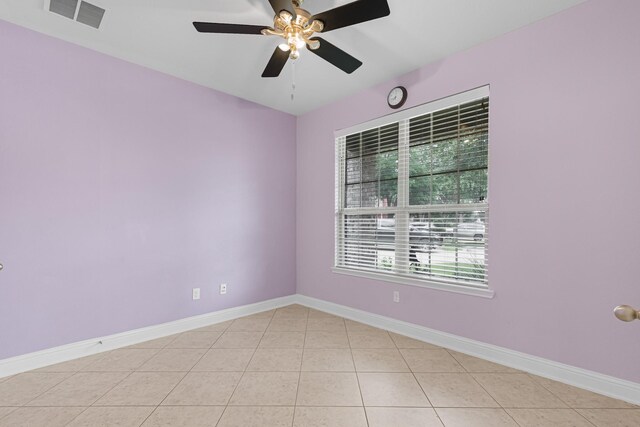 26010 Pagemill Ln, Richmond, TX 77406 - unfurnished room with light tile patterned flooring, a ceiling fan, and baseboards