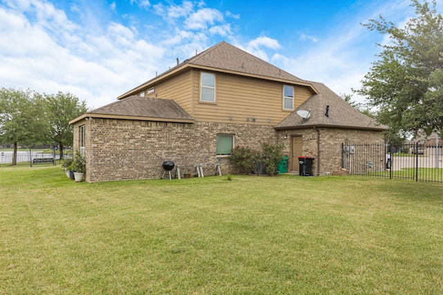 26010 Pagemill Ln, Richmond, TX 77406 - rear view of property with brick siding and a shingled roof