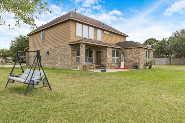 26010 Pagemill Ln, Richmond, TX 77406 - back of house with brick siding, a patio area, and roof with shingles