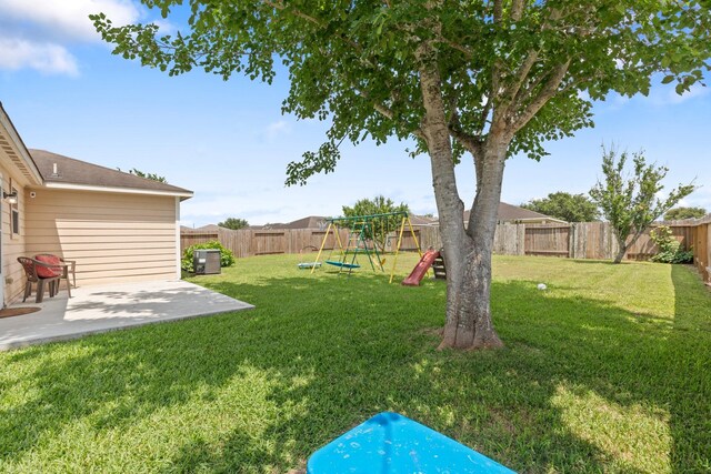 4423 Olive Field Ct, Richmond, TX 77469 - view of yard featuring a playground, a patio, and cooling unit