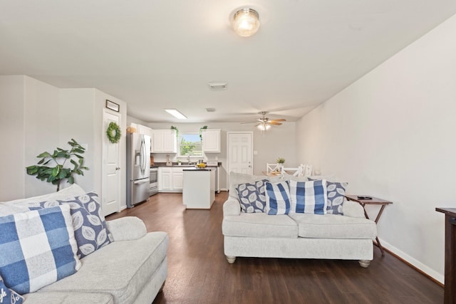 4423 Olive Field Ct, Richmond, TX 77469 - living room with dark wood-type flooring, a ceiling fan, and baseboards