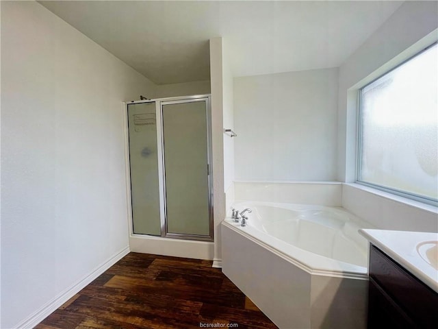 1027 Emerald Dove Ave, College Station, TX 77845 - full bathroom with a shower stall, a garden tub, wood finished floors, and vanity