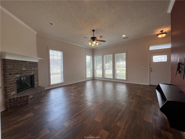 1027 Emerald Dove Ave, College Station, TX 77845 - unfurnished living room featuring dark wood-type flooring, plenty of natural light, crown molding, and recessed lighting