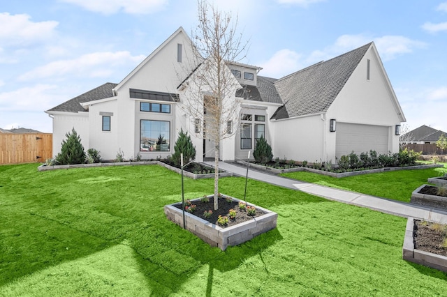 1902 Kessler Point Pl, Katy, TX 77493 - view of front of house with a garden, a shingled roof, and stucco siding