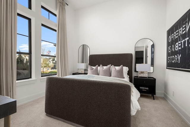 1902 Kessler Point Pl, Katy, TX 77493 - carpeted bedroom with multiple windows, a high ceiling, and baseboards