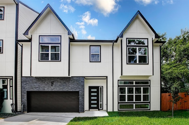 1913 Hoskins Dr Unit F, Houston, TX 77080 - view of front facade with stone siding, driveway, and an attached garage